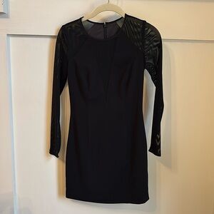 Black, Jay Godfrey minidress with mesh detailing v in chest and mesh arms.